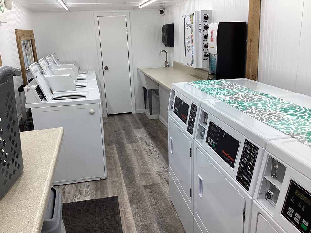 Washers and dryers in the laundry room at RIVERSIDE RV PARK