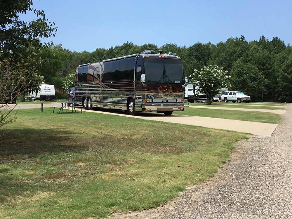 Motorhome in a pull thru site at CARTHAGE RV CAMPGROUND