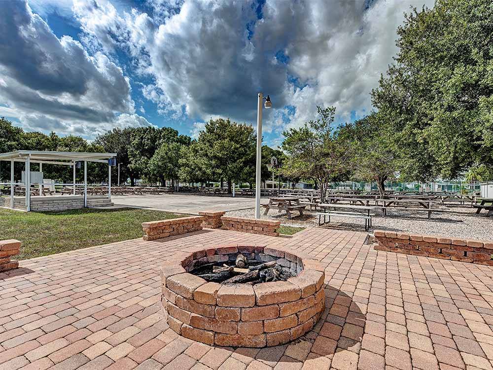The red brick fire pit at OUTBACK RV RESORT AT TANGLEWOOD