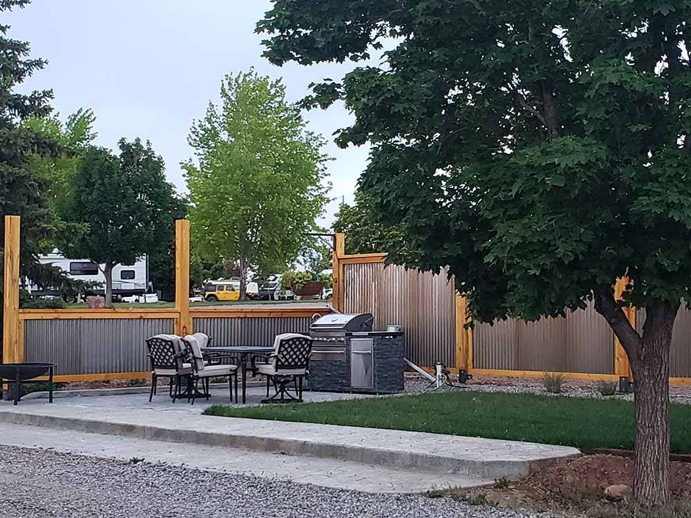 A sitting area with a barbecue at BLUE MOUNTAIN RV AND TRADING