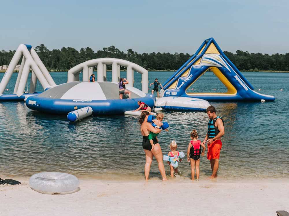 A family getting ready to go into the water at WILLOWTREE RV RESORT & CAMPGROUND