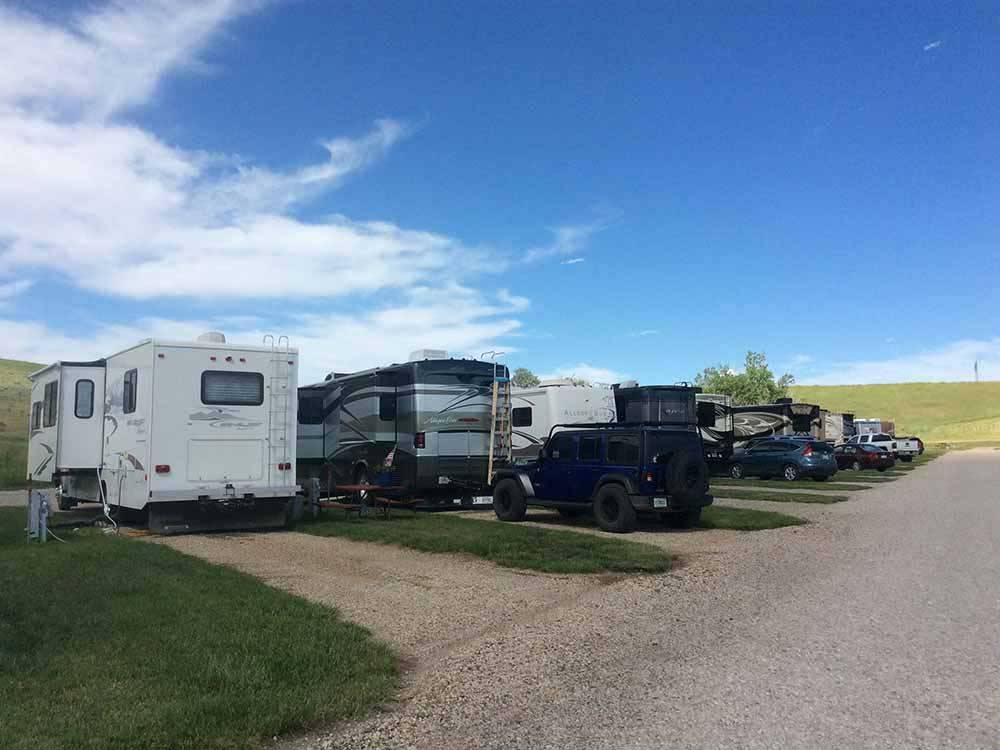 A long row of gravel RV sites at PETER D'S RV PARK