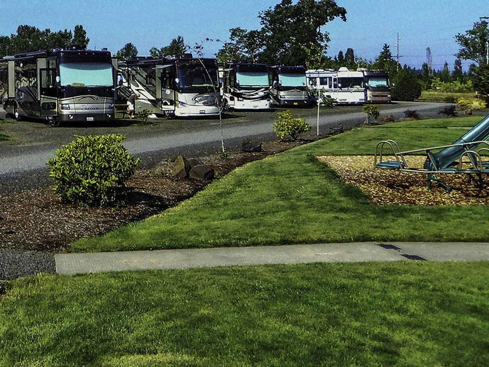 RVs parked in a row at SILVER SPUR RV PARK & RESORT