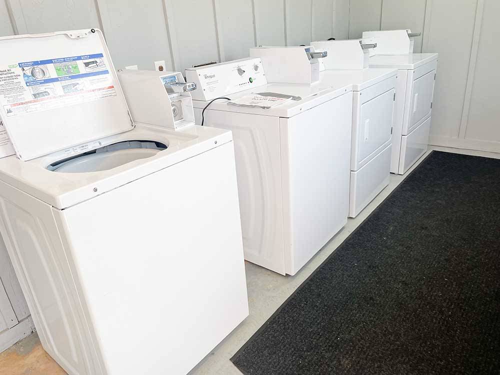 Washers and dryers in the laundry room at BAY PALMS RV RESORT