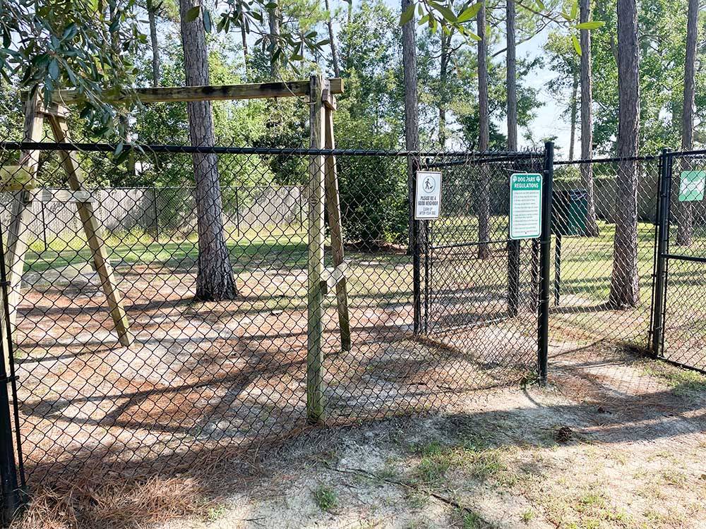 The fenced in dog area at BAY PALMS RV RESORT