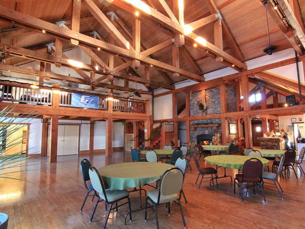 Interior of lodge with tables and chairs at MCCALL RV RESORT