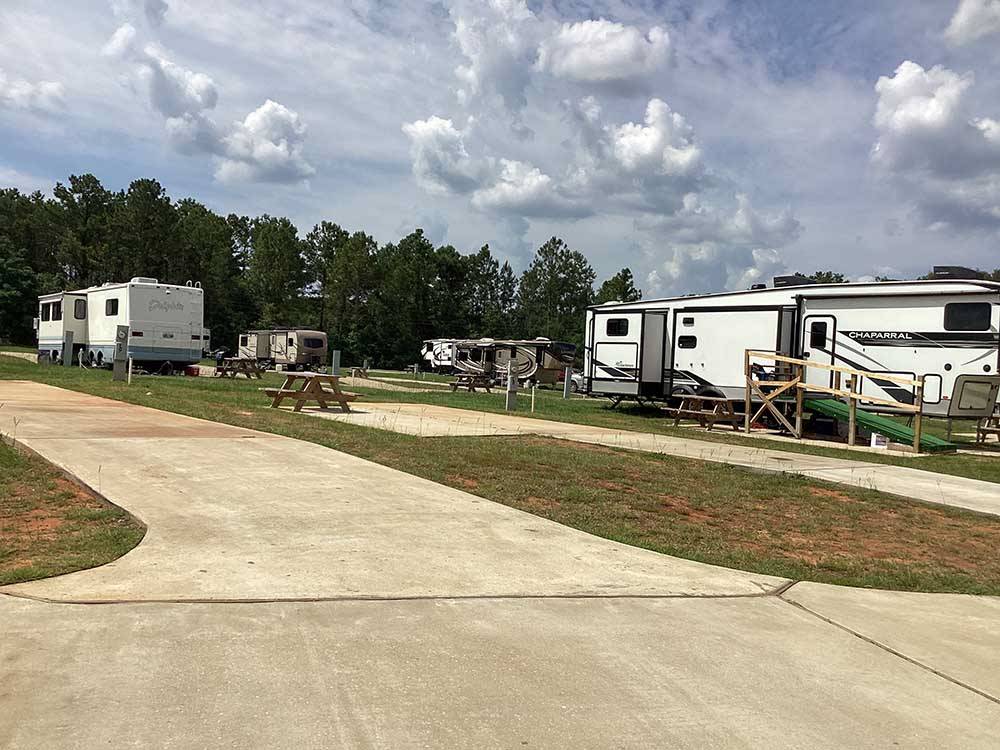 A view of trailers in paved sites at RV HIDEAWAY CAMPGROUND
