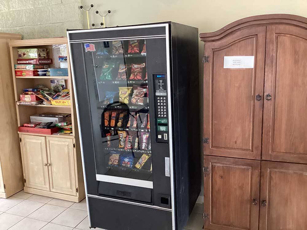 The vending machine and board game shelf at RV HIDEAWAY CAMPGROUND