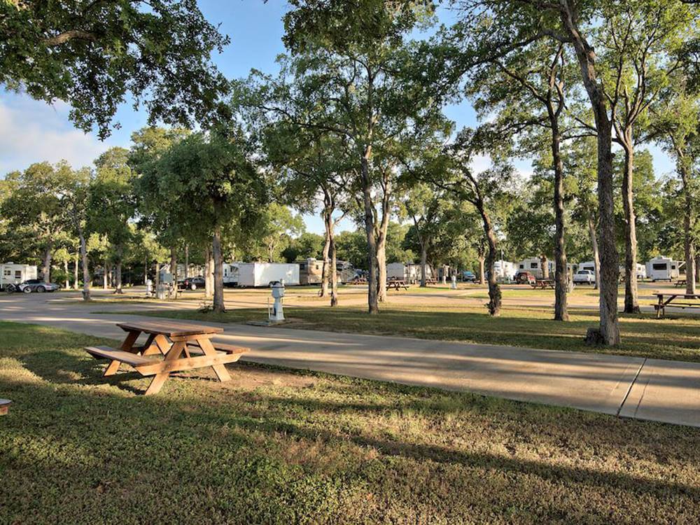 A RV site with a picnic bench at OAK FOREST RV RESORT
