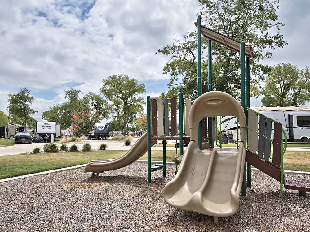 The children's playground set at OAK FOREST RV RESORT