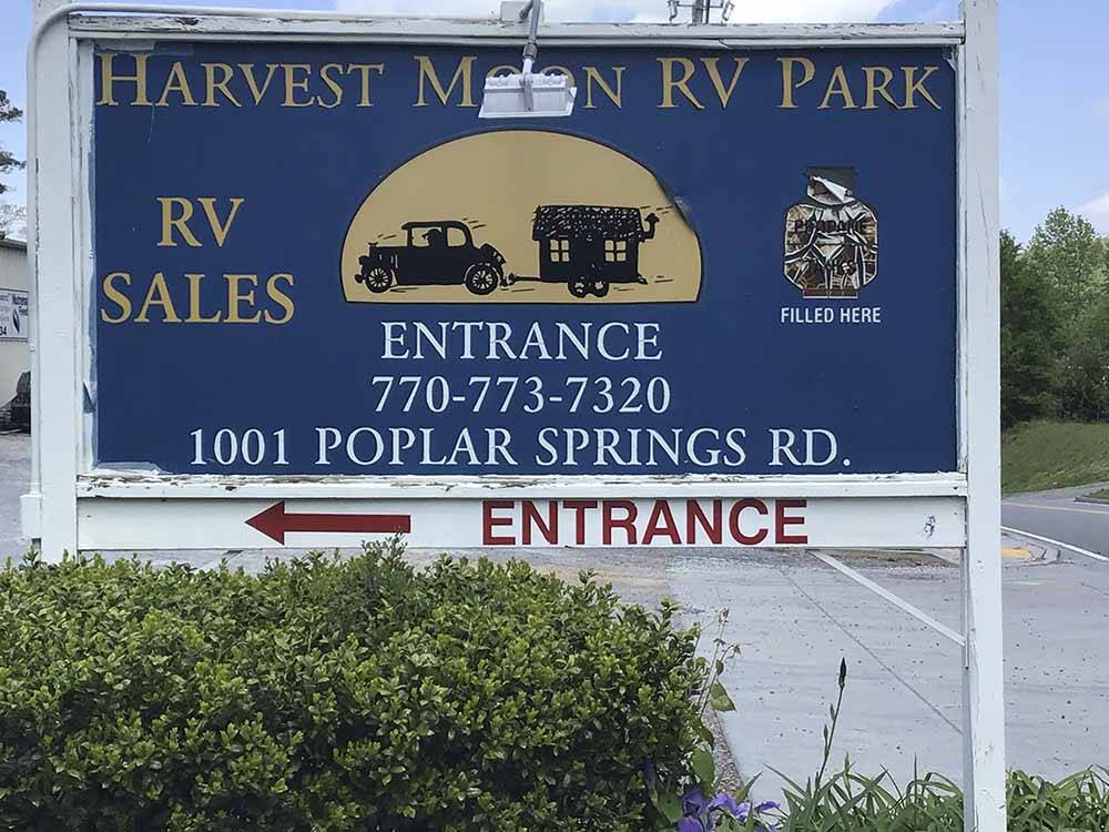 The front entrance sign at HARVEST MOON RV PARK