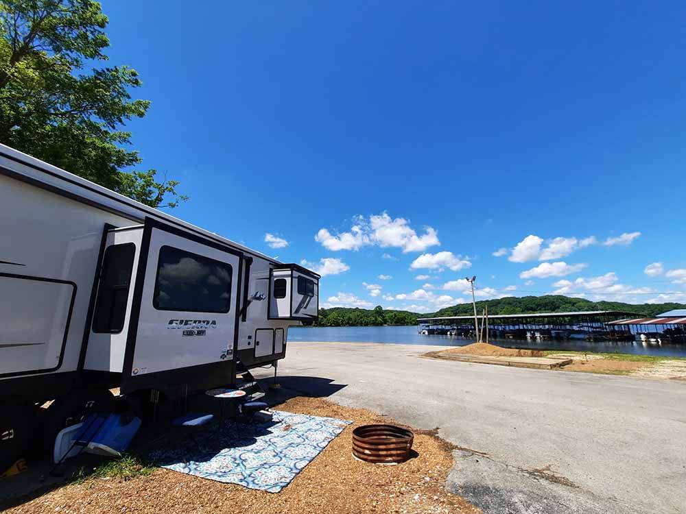 A travel trailer by the boat ramp at BIRDSONG RESORT & MARINA LAKESIDE RV & TENT CAMPGROUND