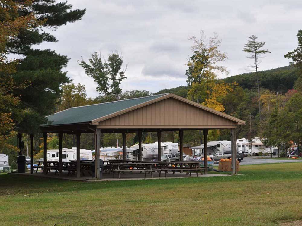 Patio area with picnic tables at TWIN GROVE RV RESORT & COTTAGES