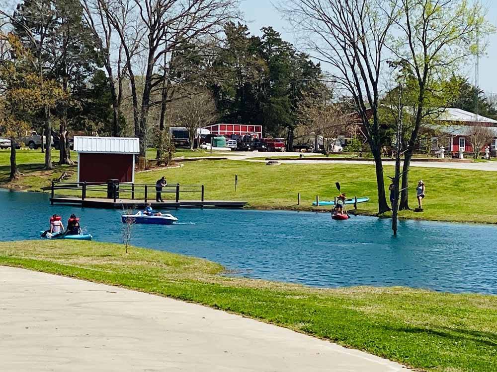 People paddling in the lake at MILL CREEK RANCH RESORT
