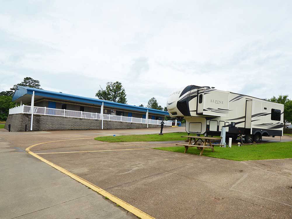The main building with a 5th Wheel trailer at SHALLOW CREEK RV RESORT