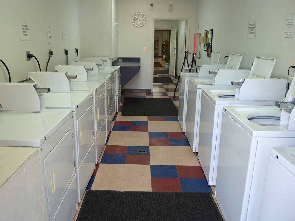 Laundry room with washer and dryers at SHALLOW CREEK RV RESORT