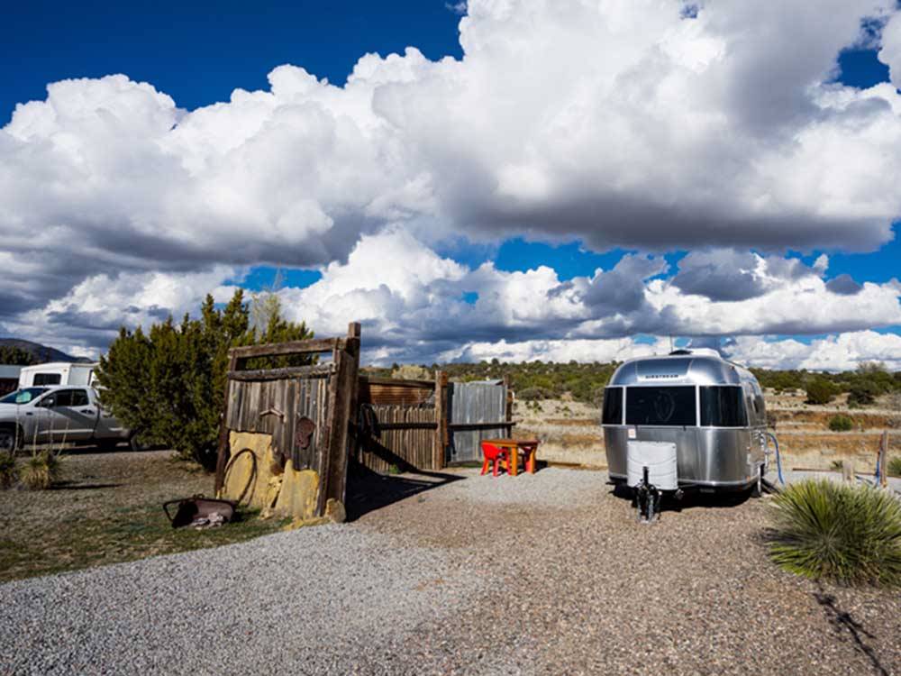 An Airstream trailer in an RV site at ROSE VALLEY RV RANCH & CASITAS