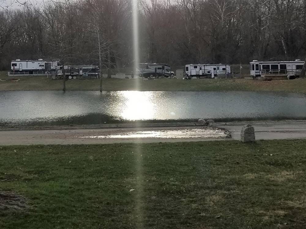 RV sites next to the the lake at MUNCIE RV RESORT BY RJOURNEY