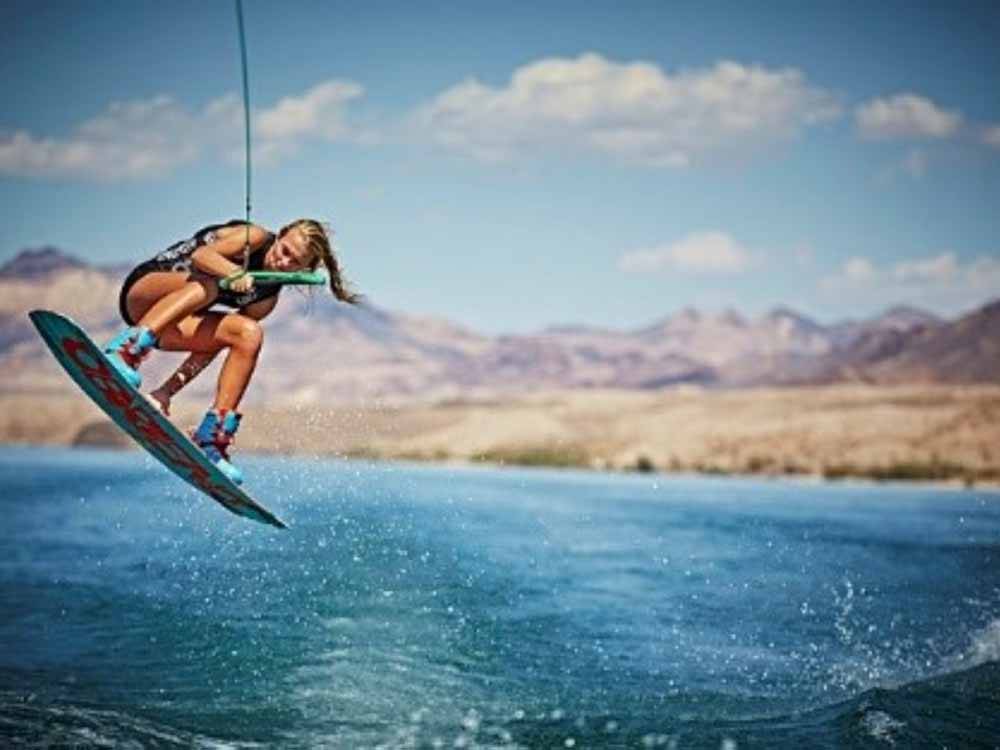 A girl wake surfing high in the air at COTTONWOOD COVE NEVADA RV PARK & MARINA