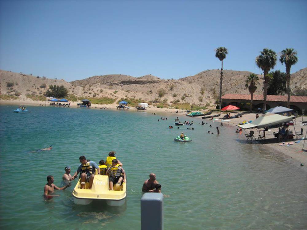A group of people in a paddleboat at COTTONWOOD COVE NEVADA RV PARK & MARINA