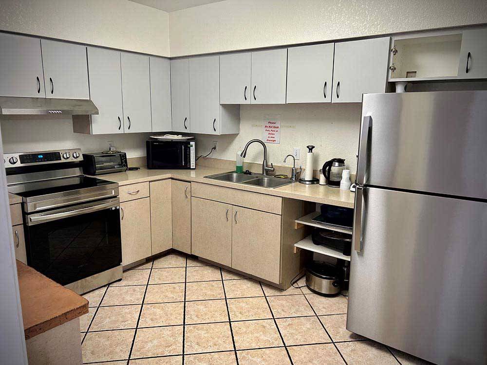 Another view of the kitchen area at DISTANT DRUMS RV RESORT
