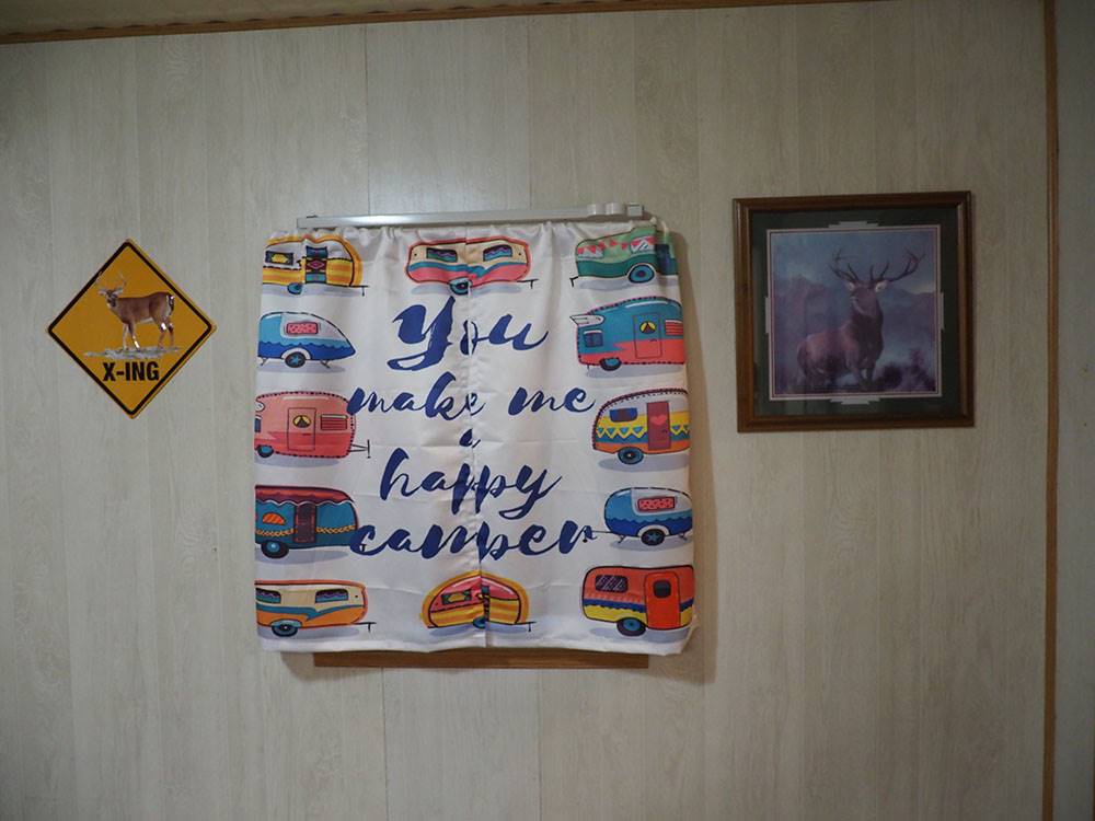 Sign on wall saying You Make Me a Happy Camper at DEER GROVE RV PARK