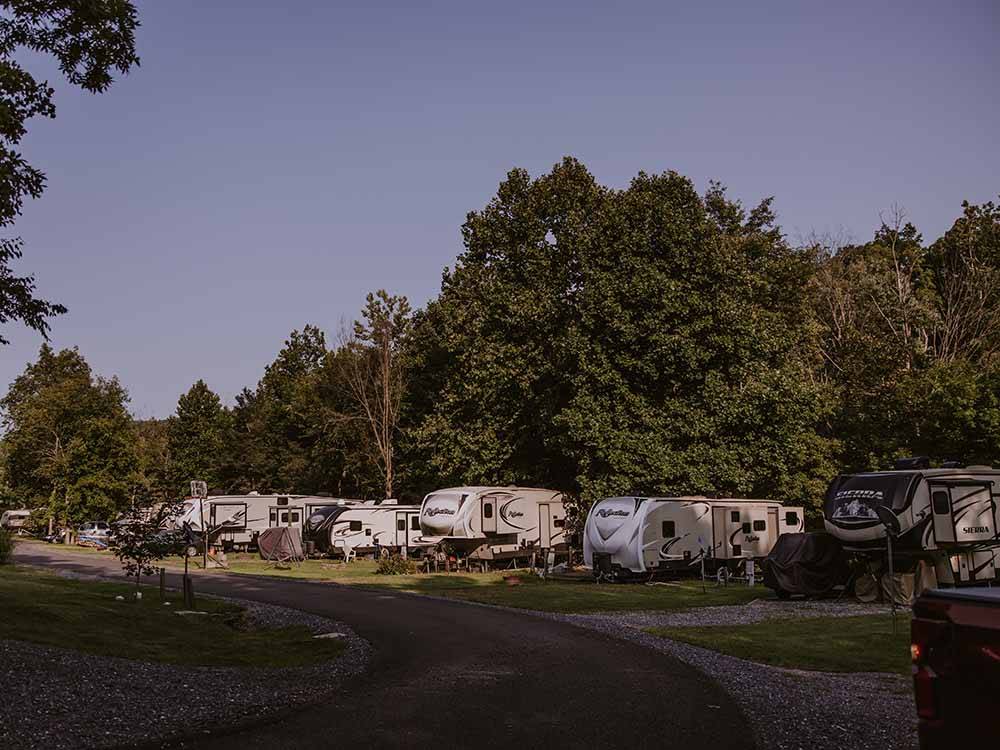 A row of trailers in RV sites at HERITAGE COVE RESORT