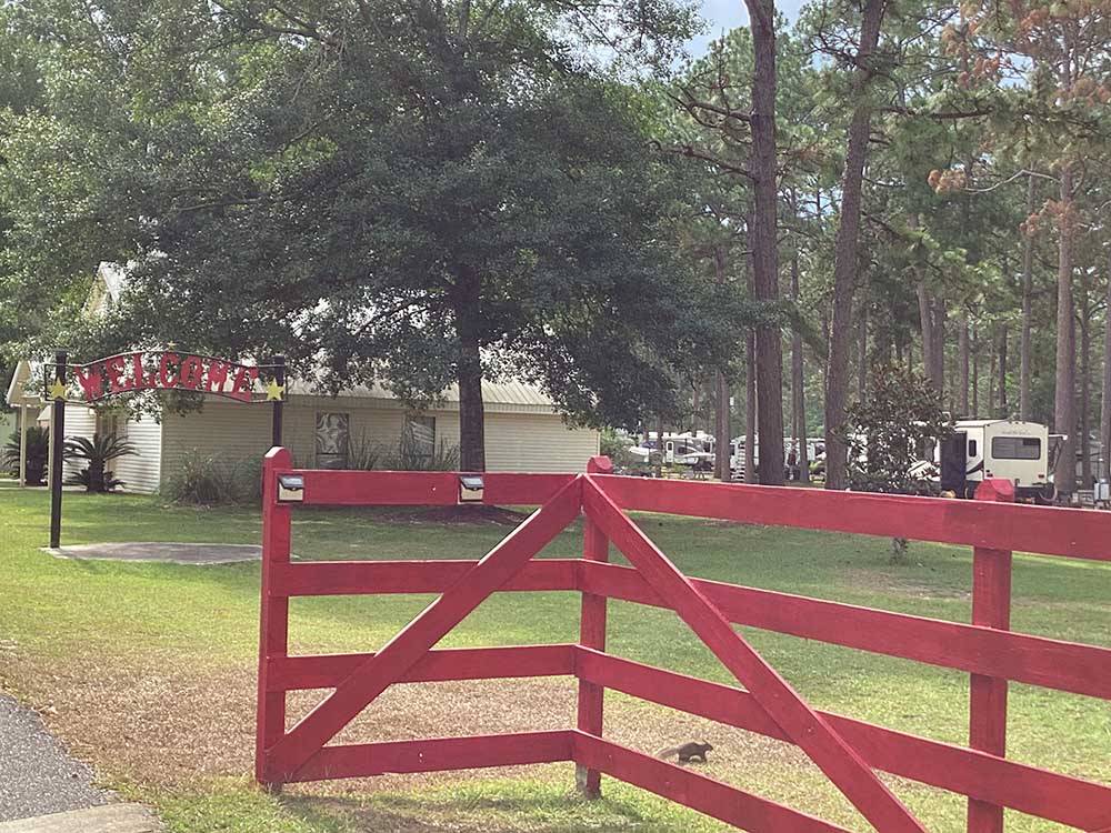 The red front entrance gate at SUN ROAMERS RV RESORT