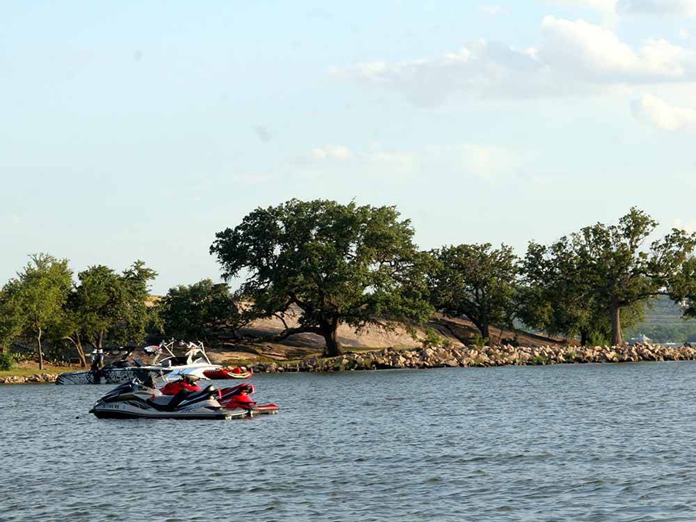 A couple of personal watercrafts on the water at SUNSET POINT ON LAKE LBJ
