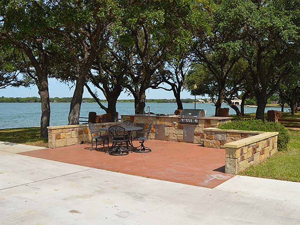 A sitting area under the trees at SUNSET POINT ON LAKE LBJ