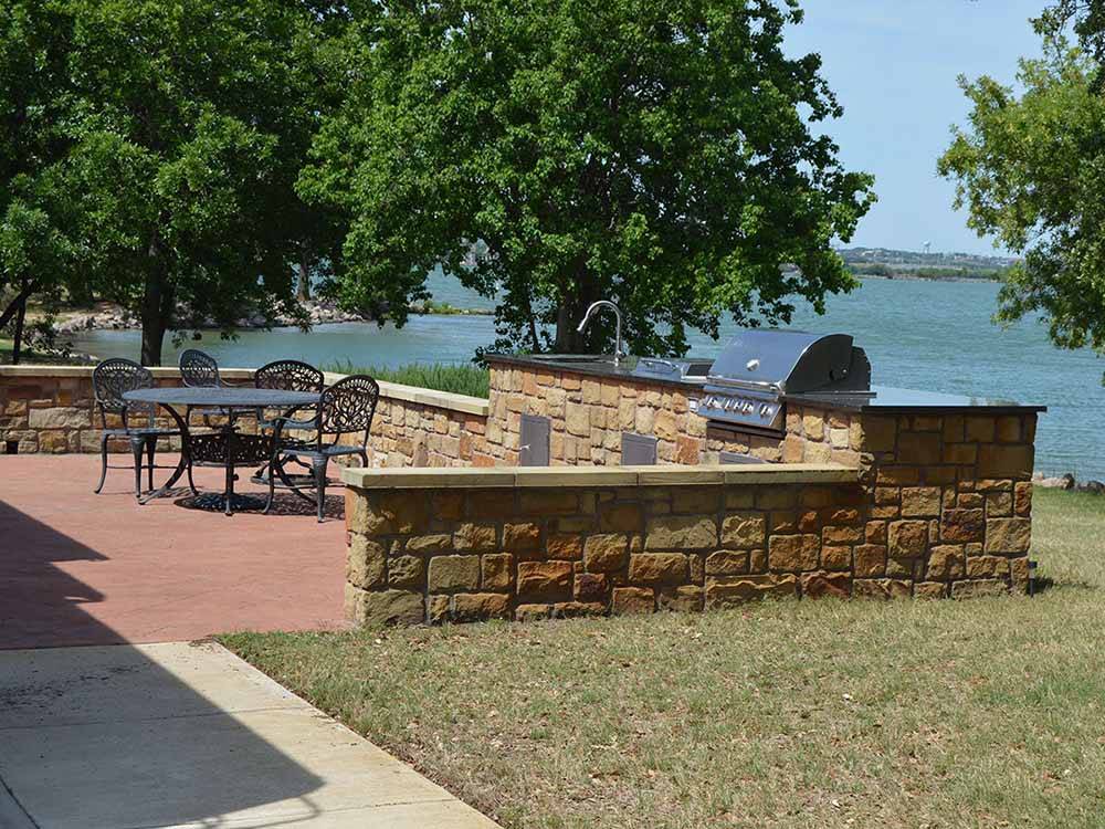 BBQ area with sink and table at SUNSET POINT ON LAKE LBJ