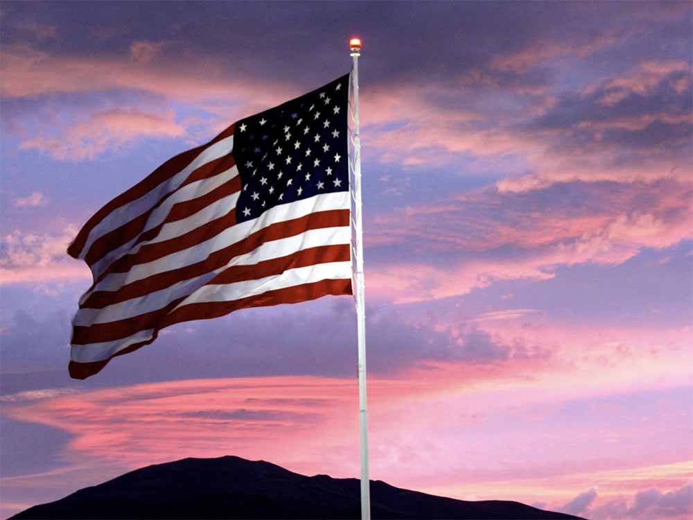 The American Flag at dusk at WHISKEY FLATS RV PARK