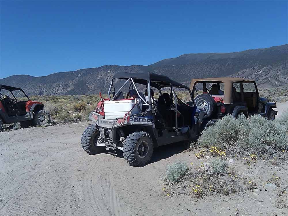 A couple of off road vehicles at WHISKEY FLATS RV PARK