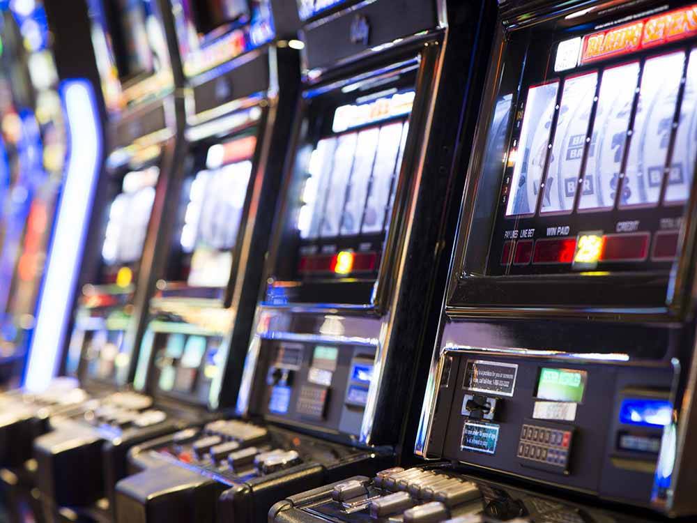 A line of slot machines at CENTURY CASINO & RV PARK