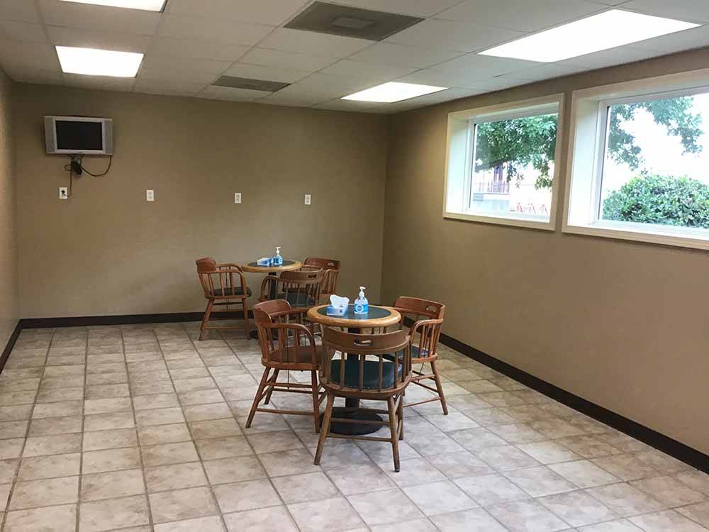 A couple of round tables in a room at CENTURY CASINO & RV PARK