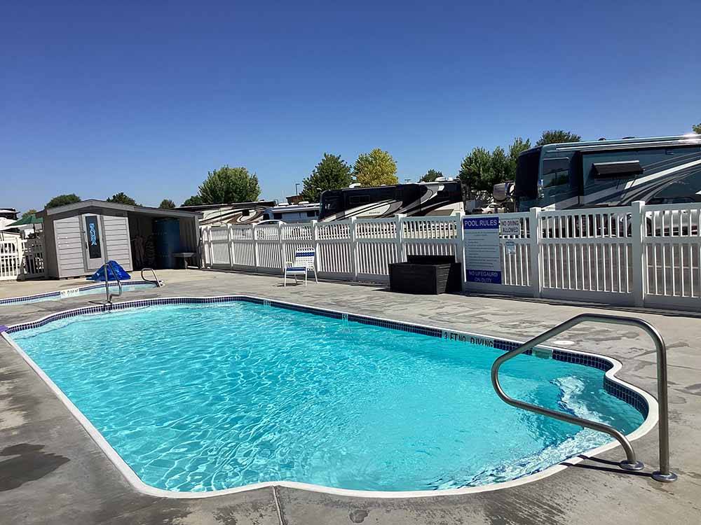 The swimming pool area at AMBASSADOR RV RESORT