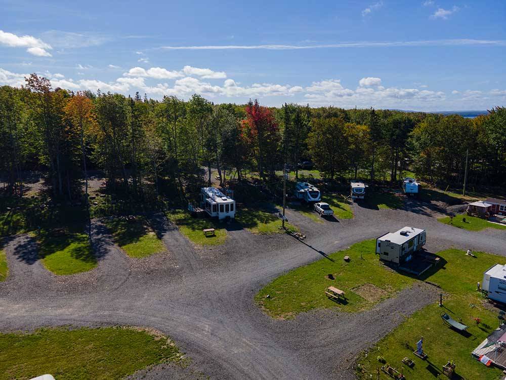 Travel trailers parked in sites at ADVENTURES EAST CAMPGROUND & COTTAGES