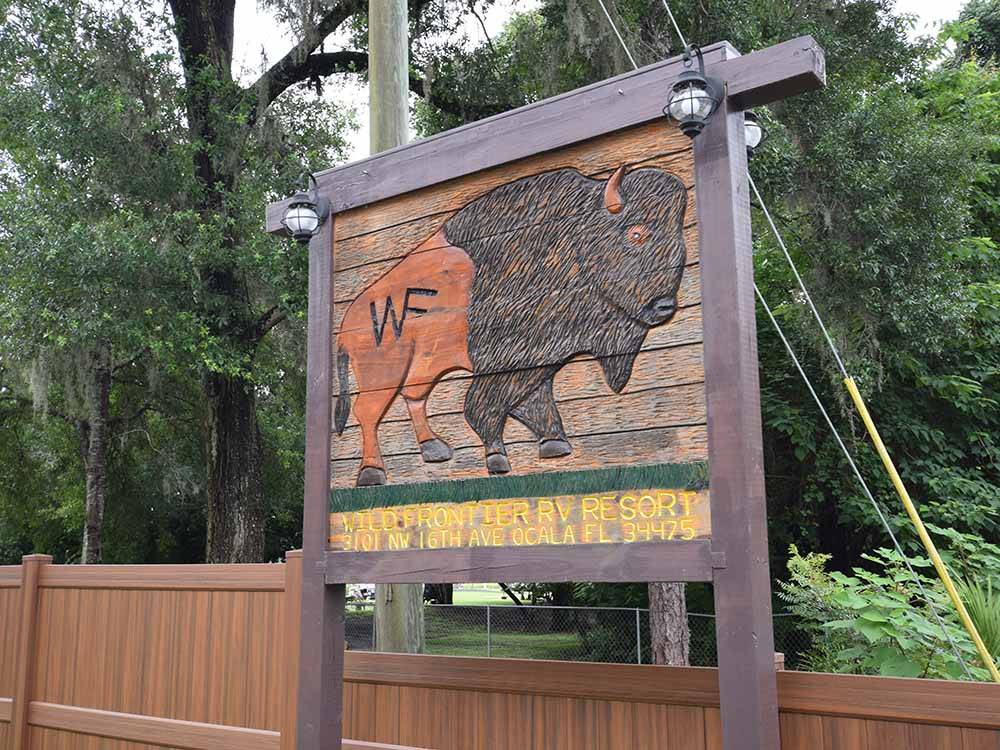 The front entrance sign at WILD FRONTIER RV RESORT