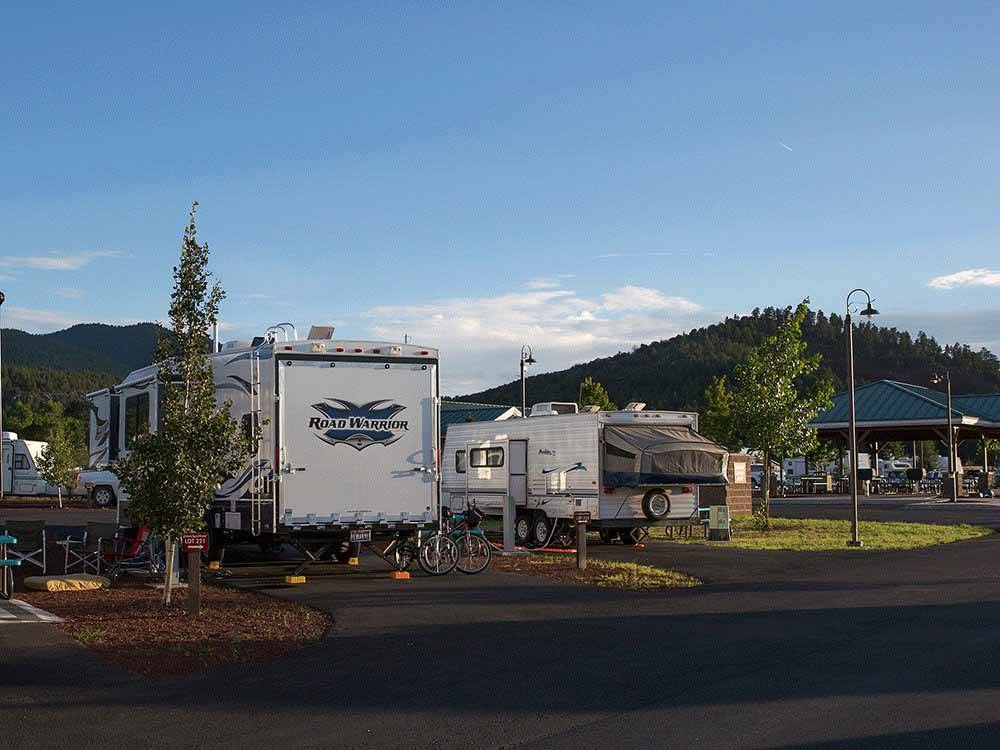 Two fifth wheel trailers parked in a RV site at GRAND CANYON RAILWAY RV PARK