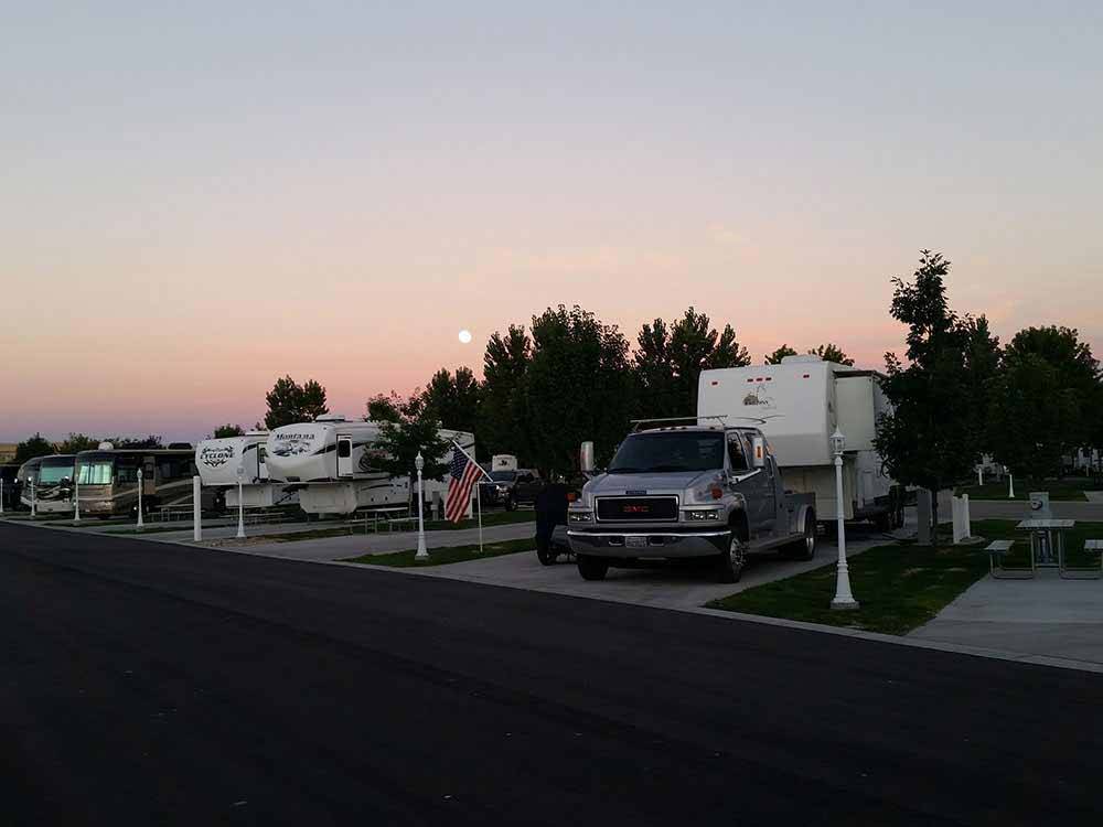 A row of paved RV sites at dusk at MOUNTAIN HOME RV RESORT