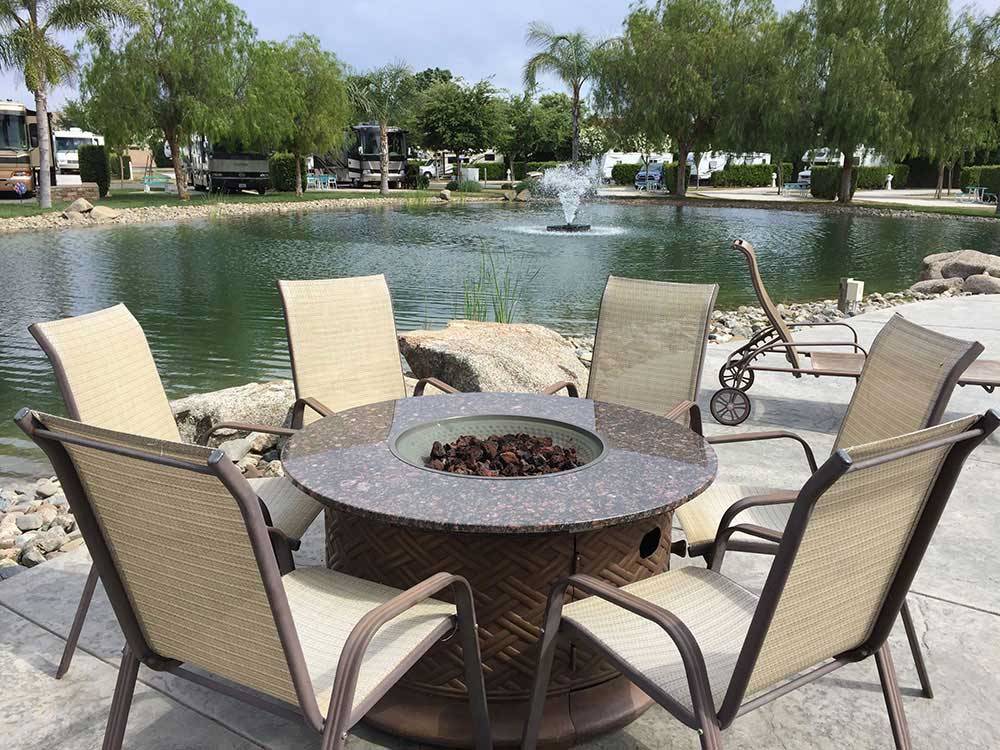 Patio area with chairs at THE LAKES RV & GOLF RESORT
