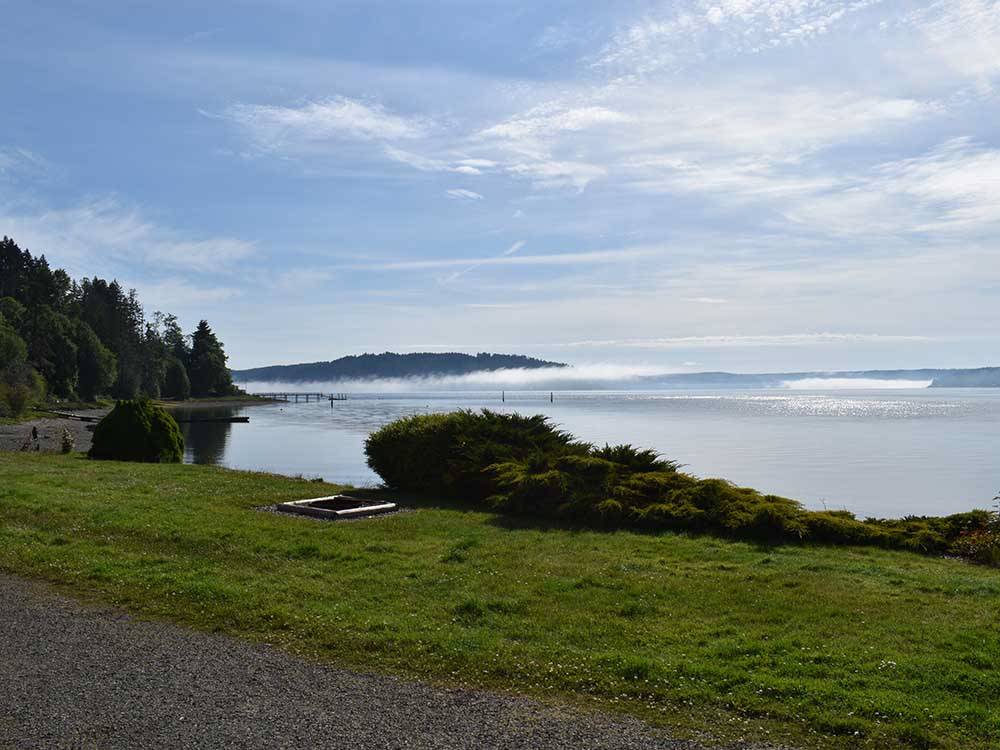 A view of the lake with mist over the water at THE WATERFRONT AT POTLATCH RESORT & RV PARK