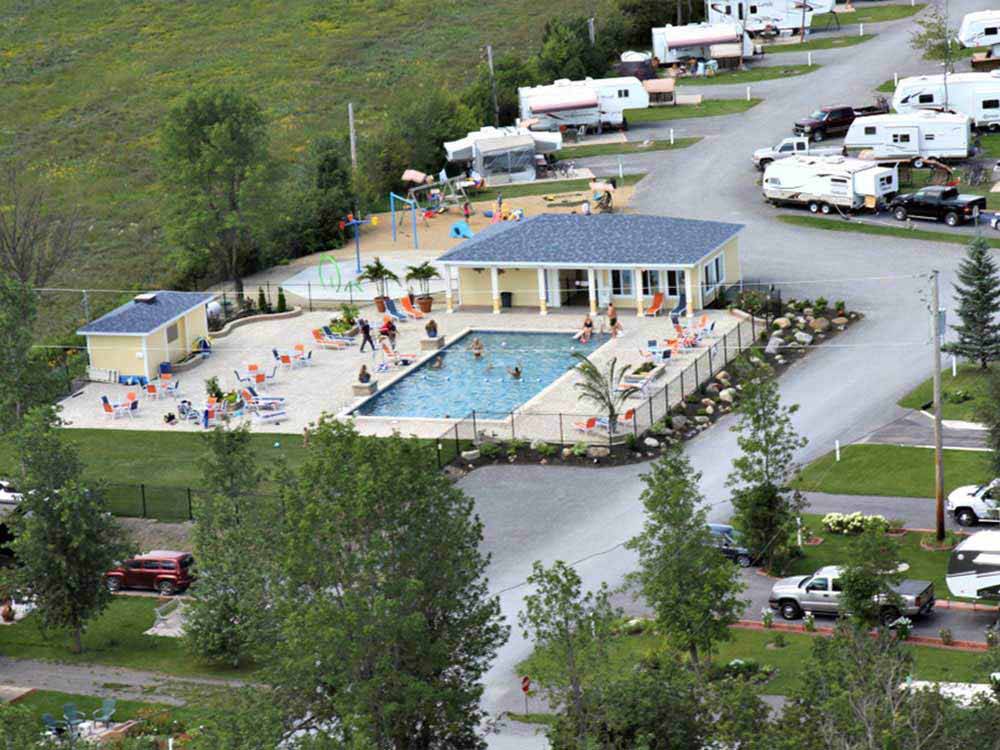 An empty site next to the playground at CAMPING LA CLE DES CHAMPS RV RESORT