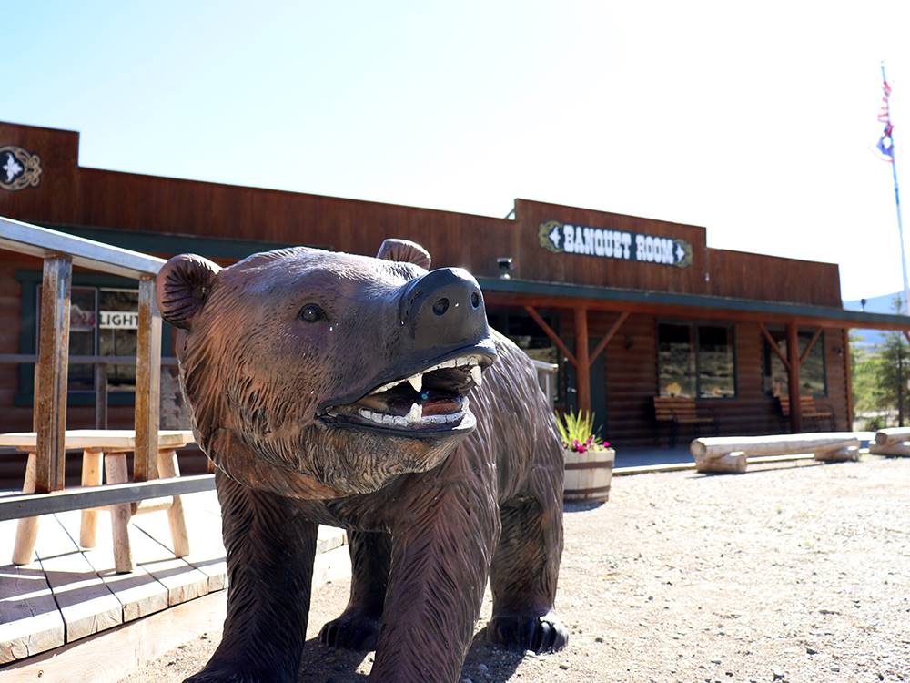 A large bear statue in front of the banquet room at YELLOWSTONE VALLEY INN & RV PARK