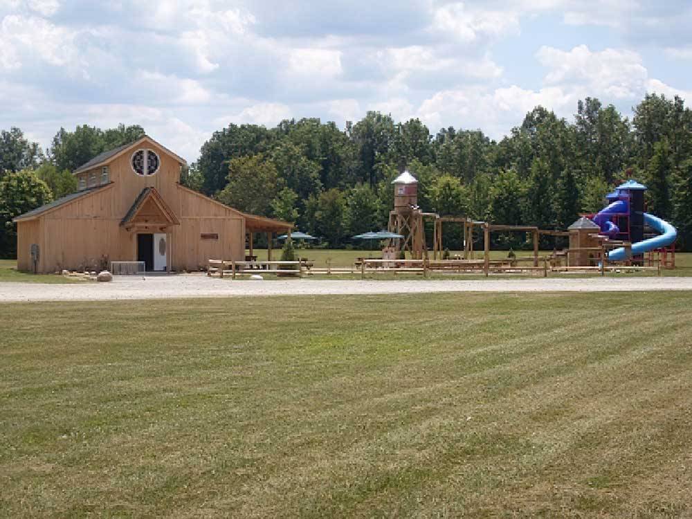 A building and playground equipment at AMERICAN WILDERNESS CAMPGROUND