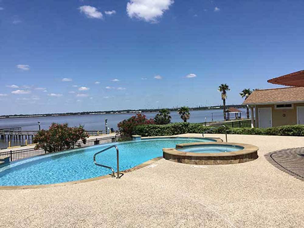 The hot tub and swimming pool overlooking the river at SAN JACINTO RIVERFRONT RV PARK