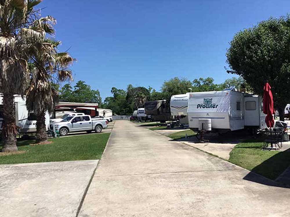 A paved road between the paver RV sites at SAN JACINTO RIVERFRONT RV PARK