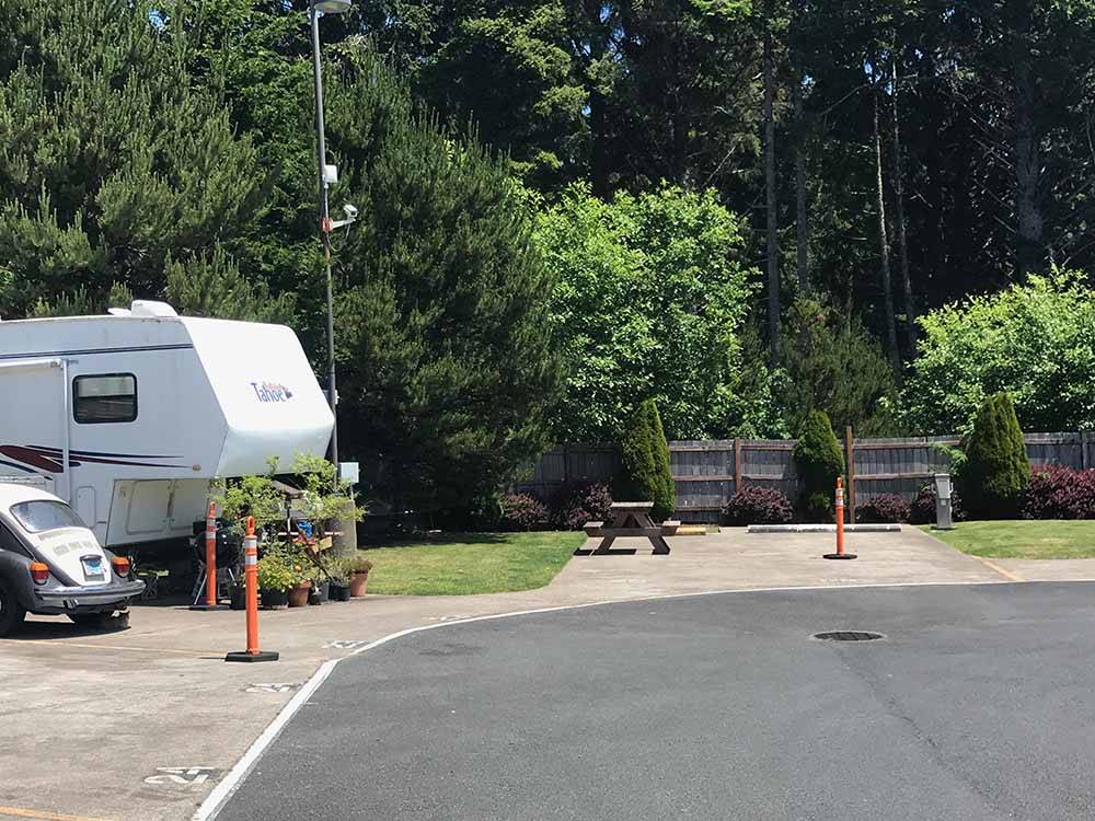 Paved RV sites with picnic benches at LOGAN ROAD RV PARK
