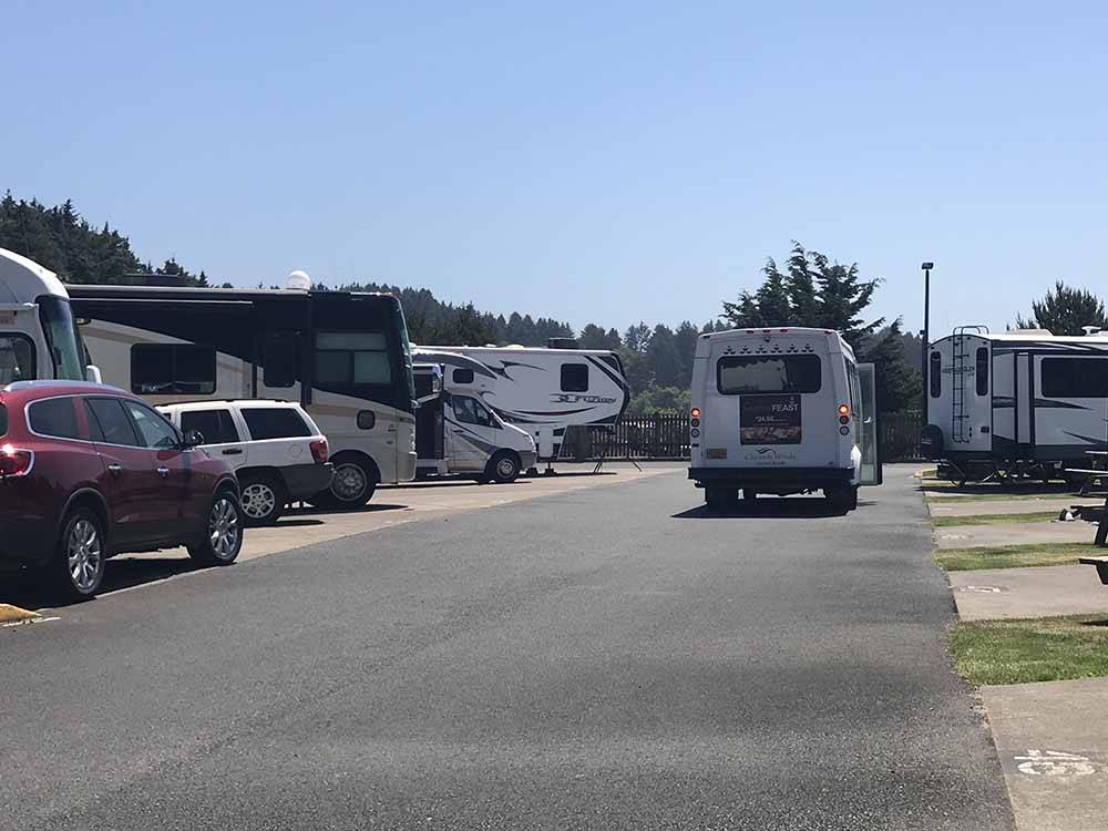 A shuttle bus picking people up at LOGAN ROAD RV PARK