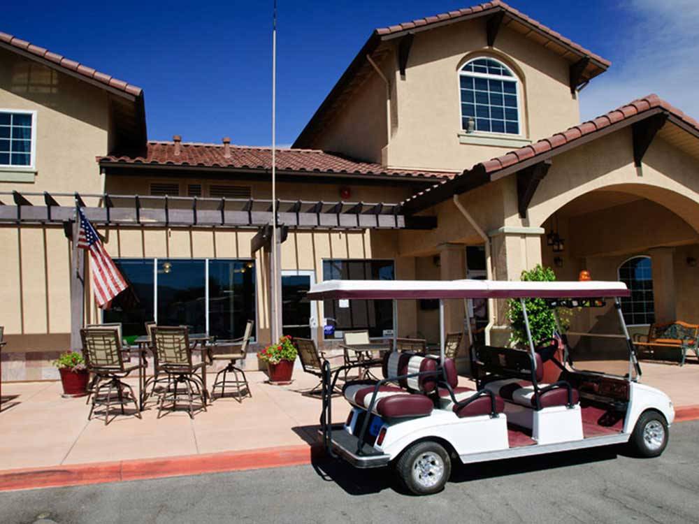 Six person golf cart out front of main office at COYOTE VALLEY RV RESORT